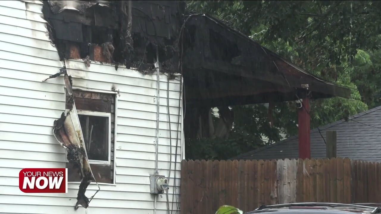 Flames tear through Lima residence, firefighters rescue a dog